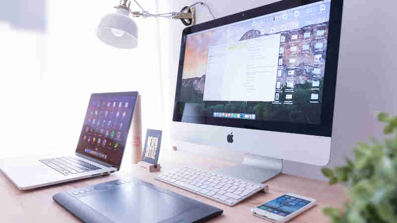 Workstation with desktop and laptop ready for web design work | CoencE Web Development & Marketing